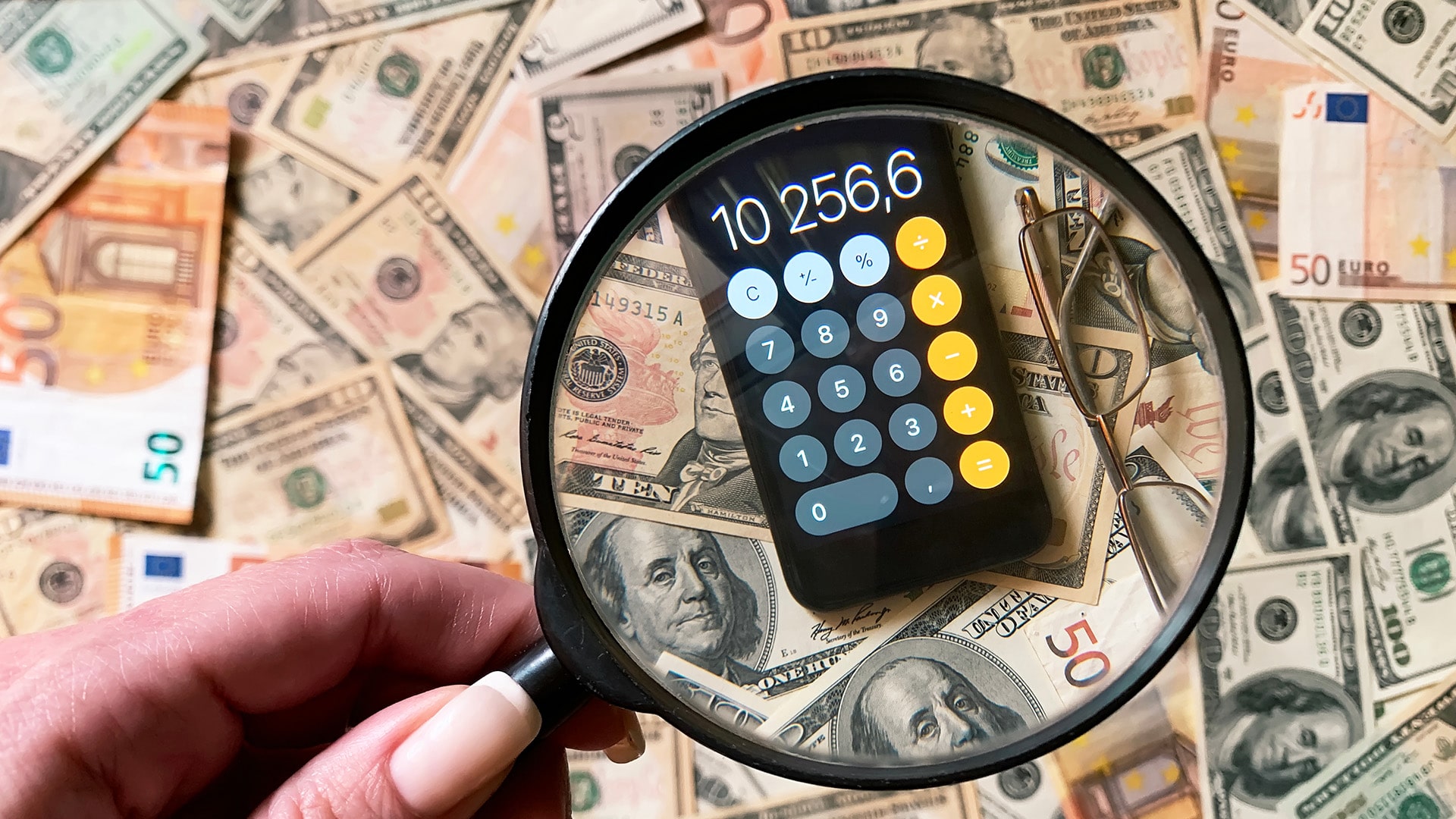 Magnifying glass over calculator
