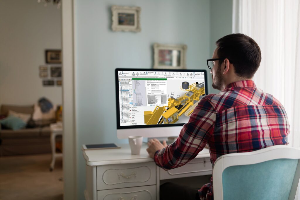 Man working remotely on 3D modeling software through virtual access to a local training lab