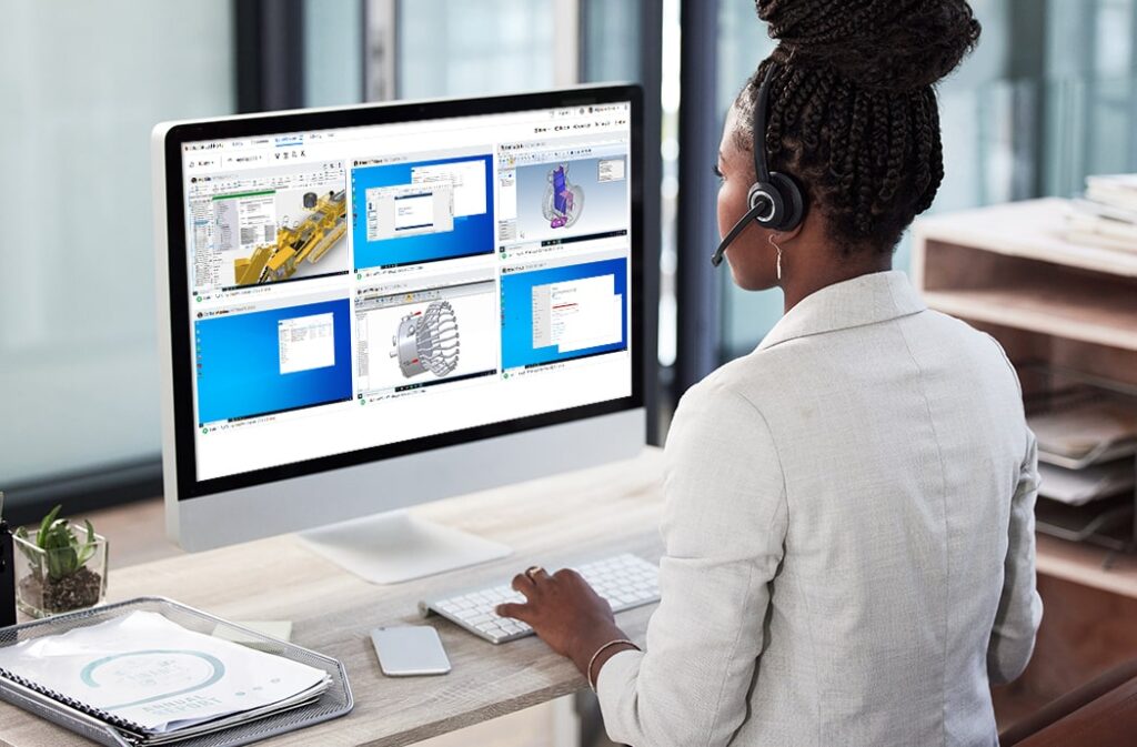 A remote instructor monitors student screens using ReadyTech’s virtual training lab software in a modern office setting.