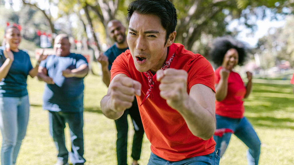 Really excited guy pointing at the camera showcasing enablement teams in virtual it labs